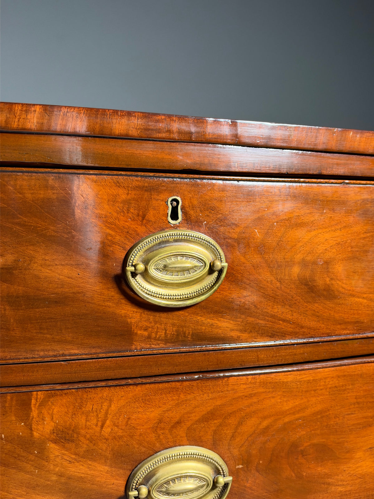 English bow-front chest of drawers in mahogany