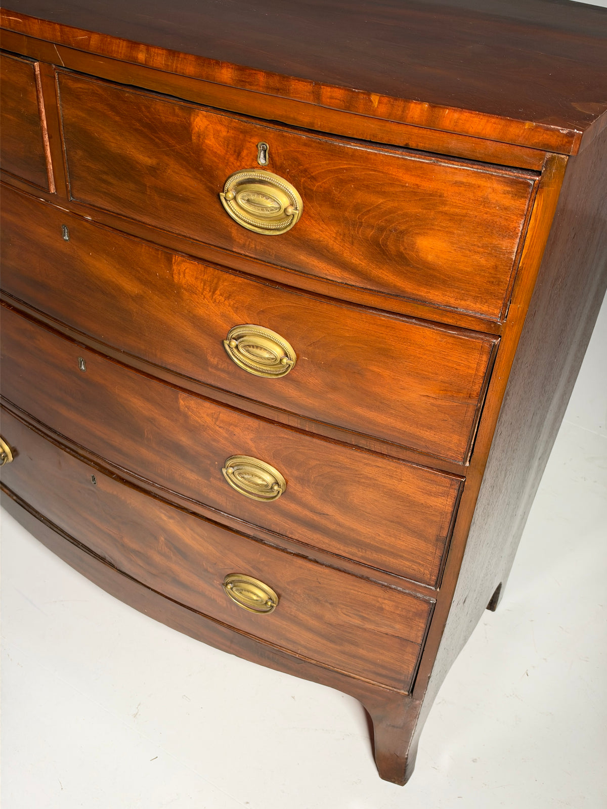 English bow-front chest of drawers in mahogany