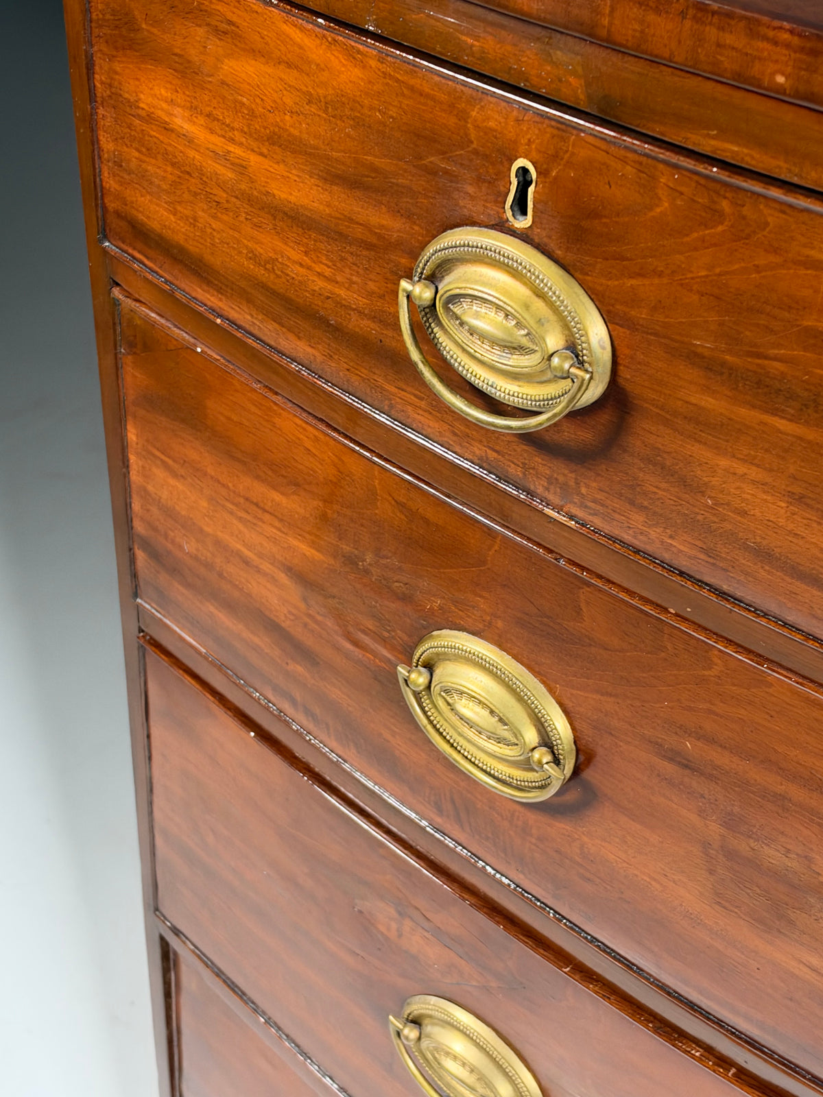 English bow-front chest of drawers in mahogany