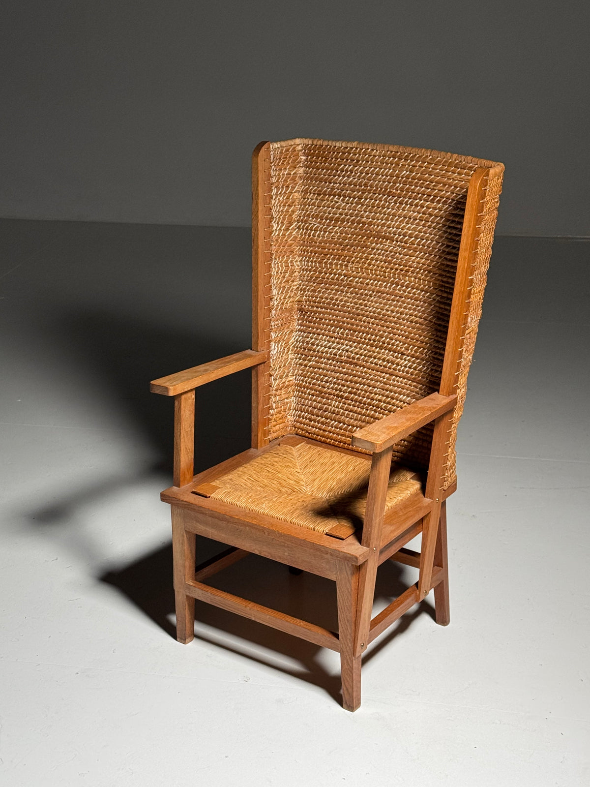 Armchair with a woven backrest