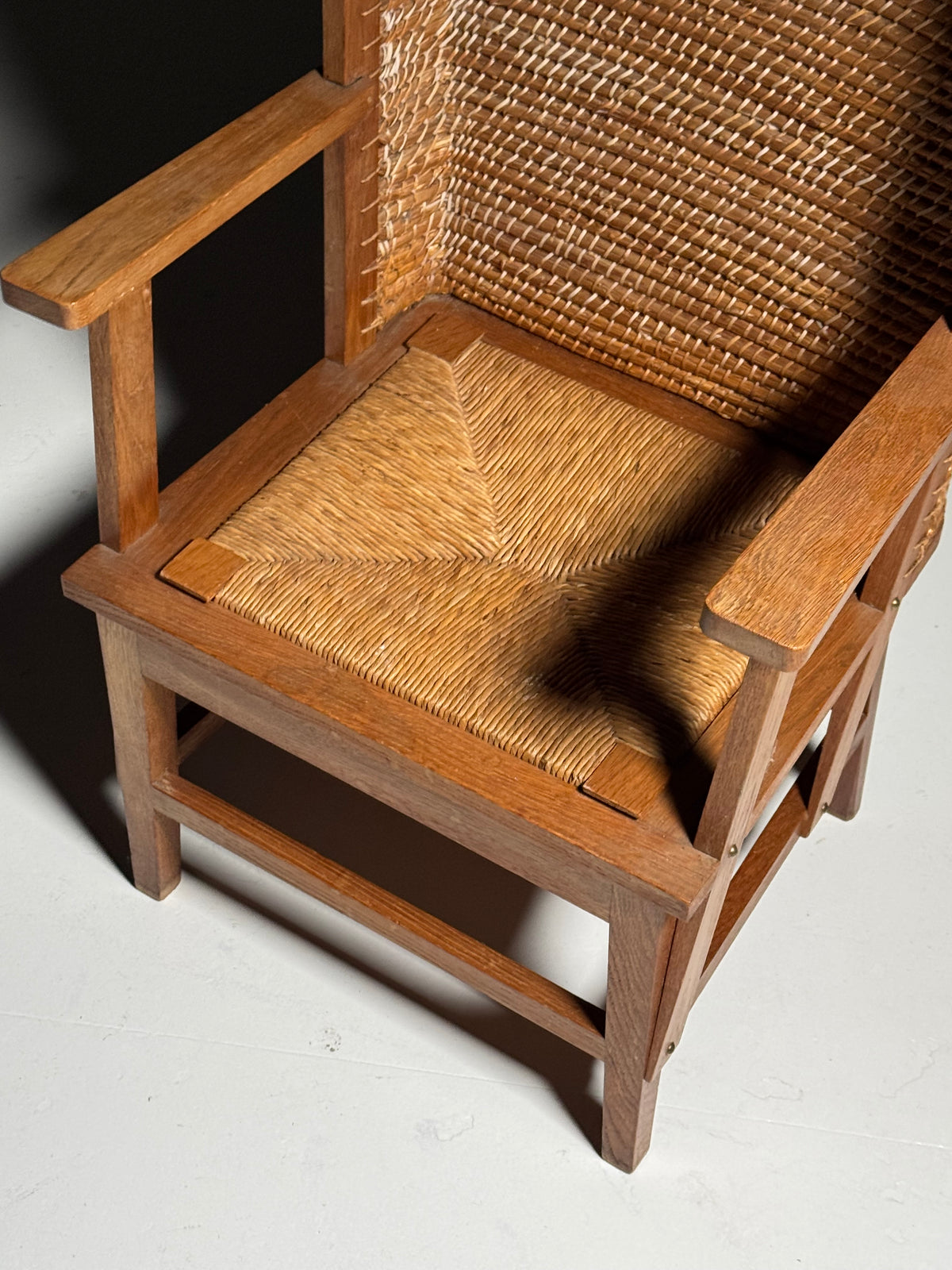 Armchair with a woven backrest
