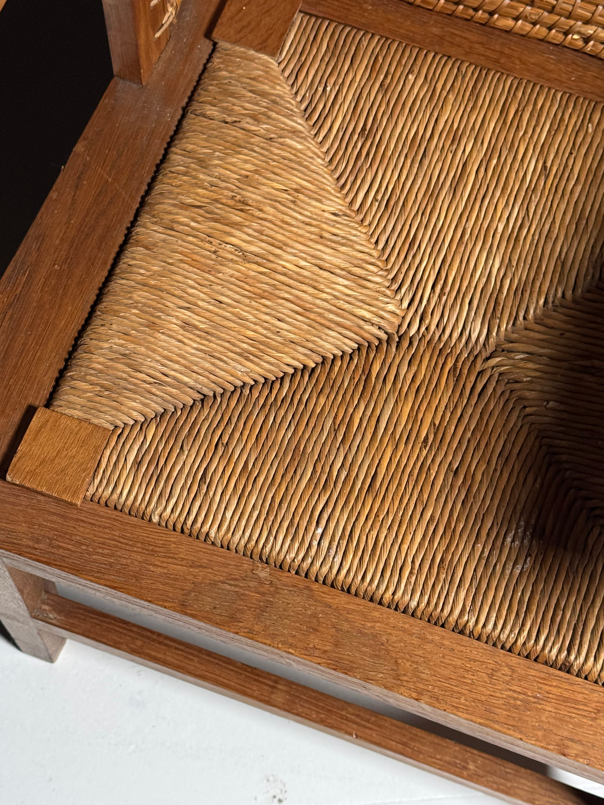 Armchair with a woven backrest