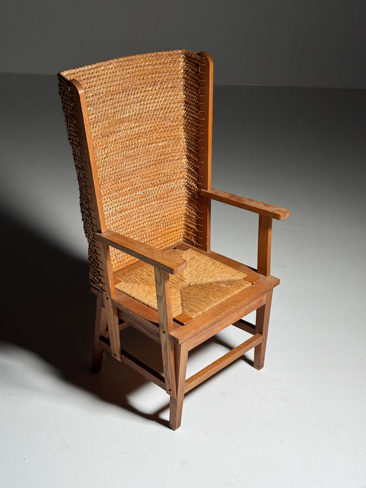 Armchair with a woven backrest