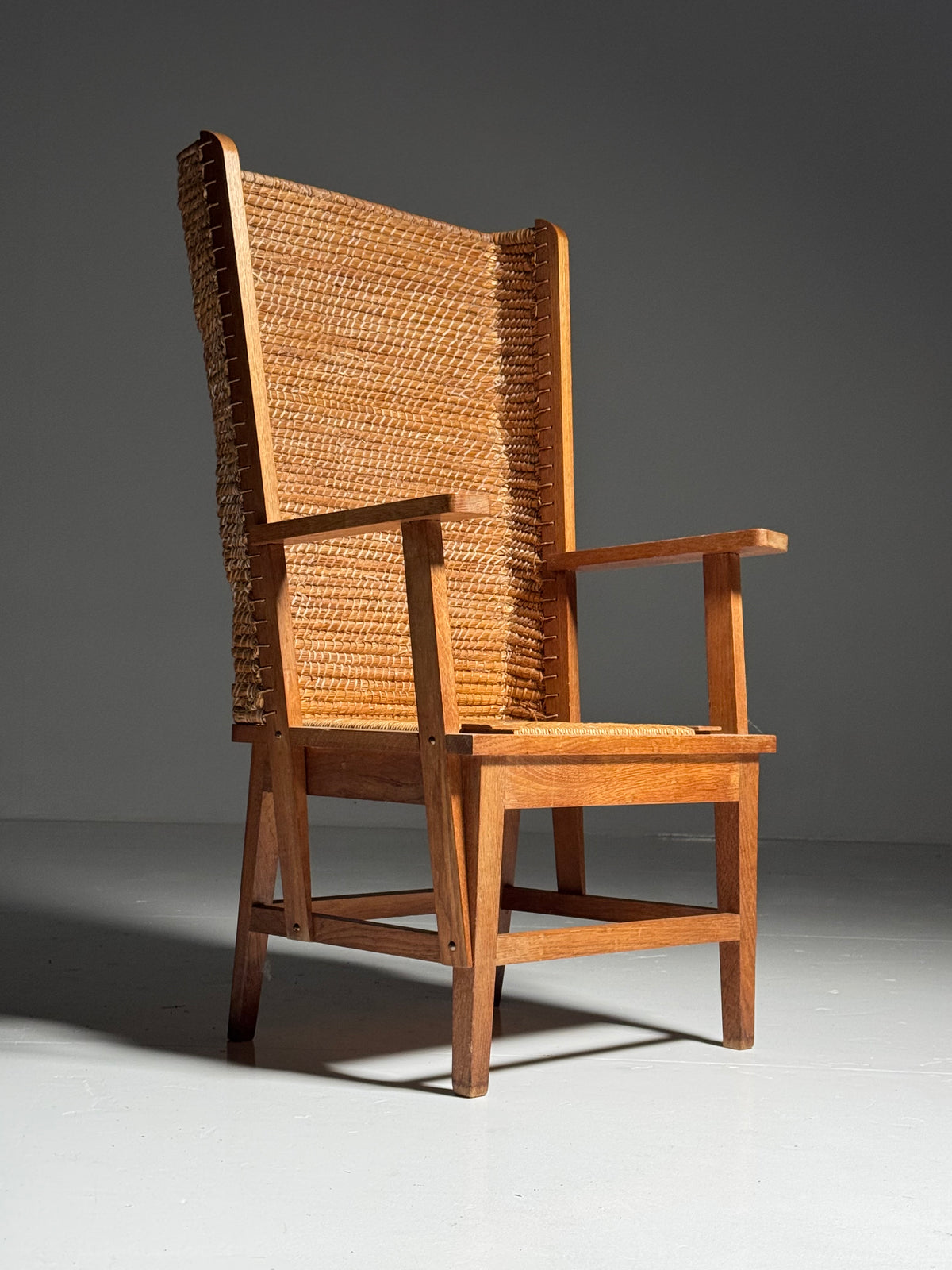 Armchair with a woven backrest