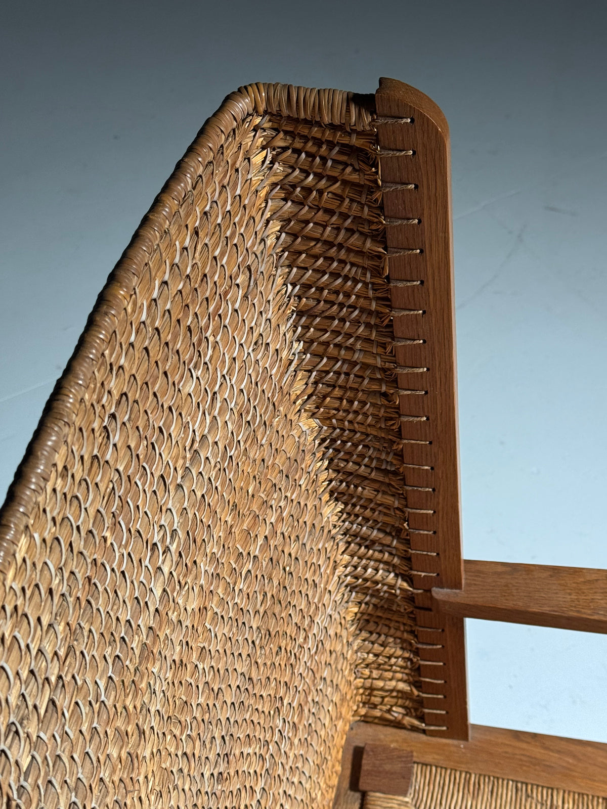 Armchair with a woven backrest
