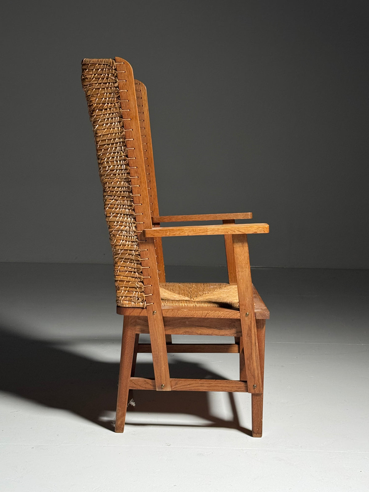 Armchair with a woven backrest
