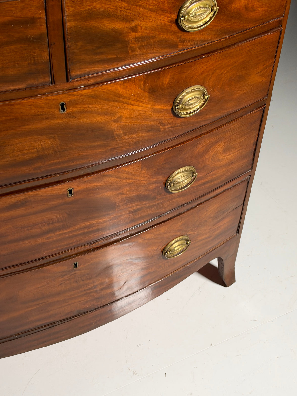English bow-front chest of drawers in mahogany