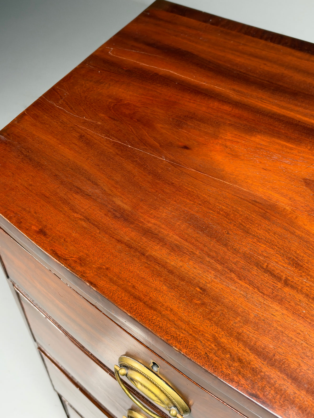English bow-front chest of drawers in mahogany