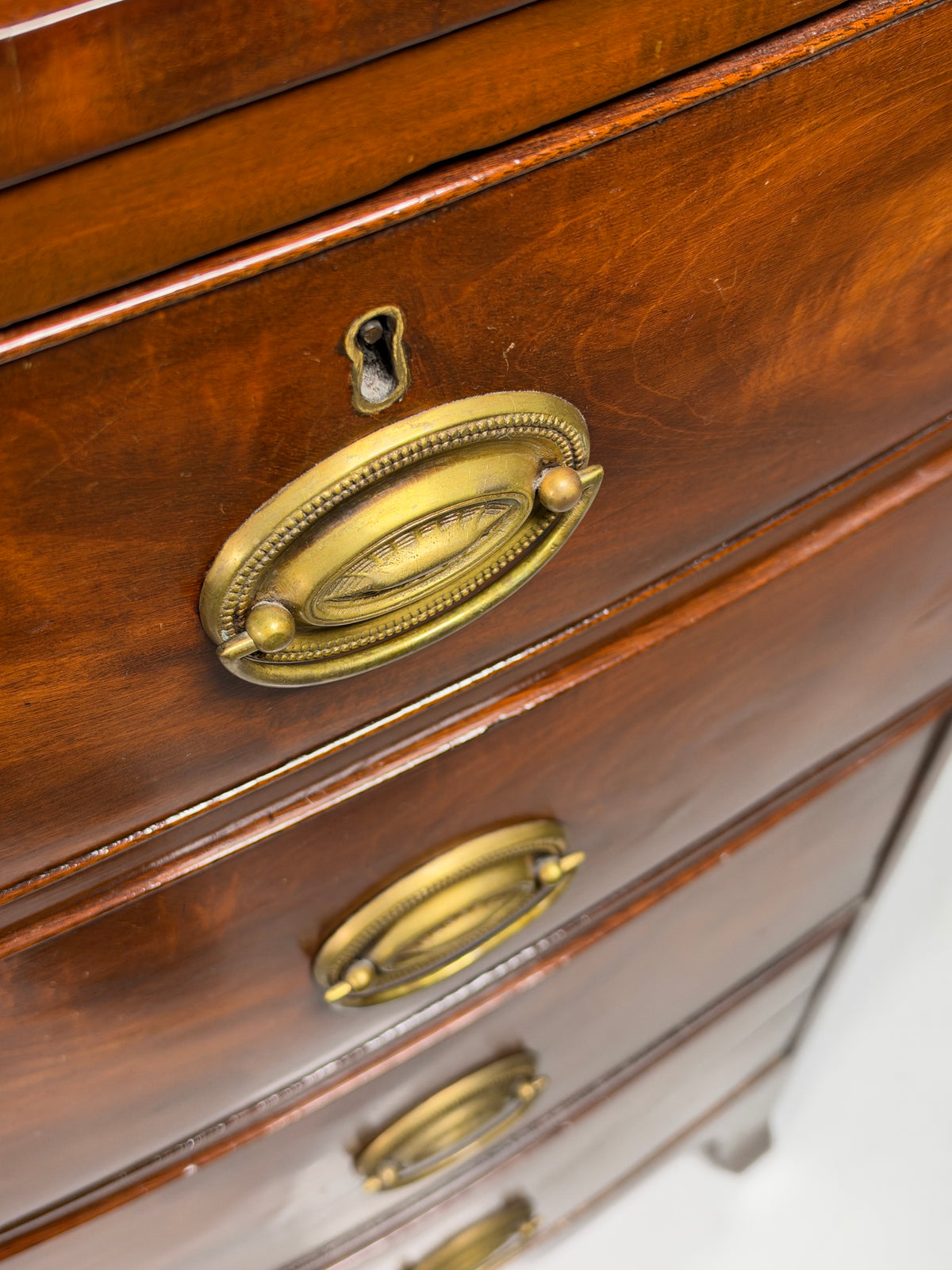 English bow-front chest of drawers in mahogany