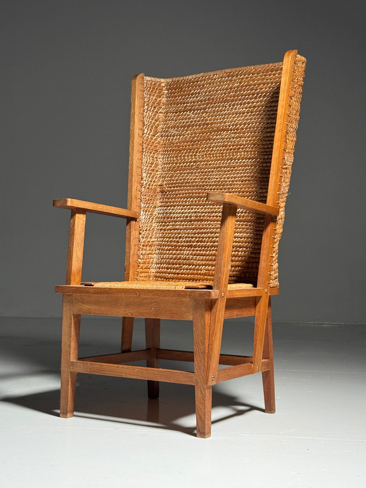 Armchair with a woven backrest