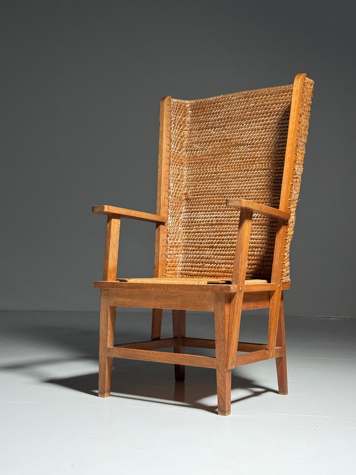 Armchair with a woven backrest