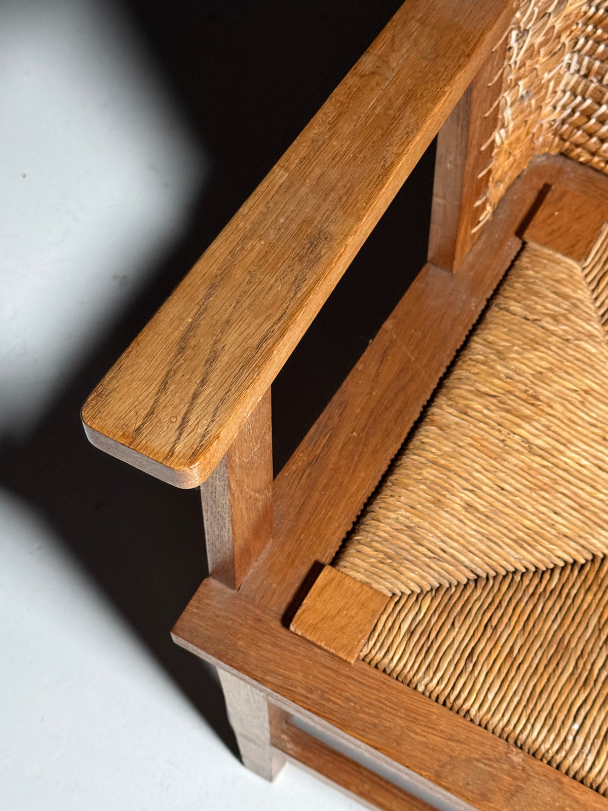 Armchair with a woven backrest