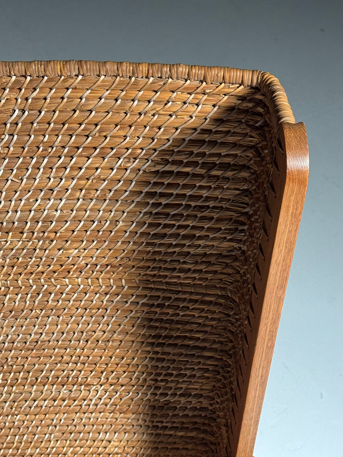 Armchair with a woven backrest