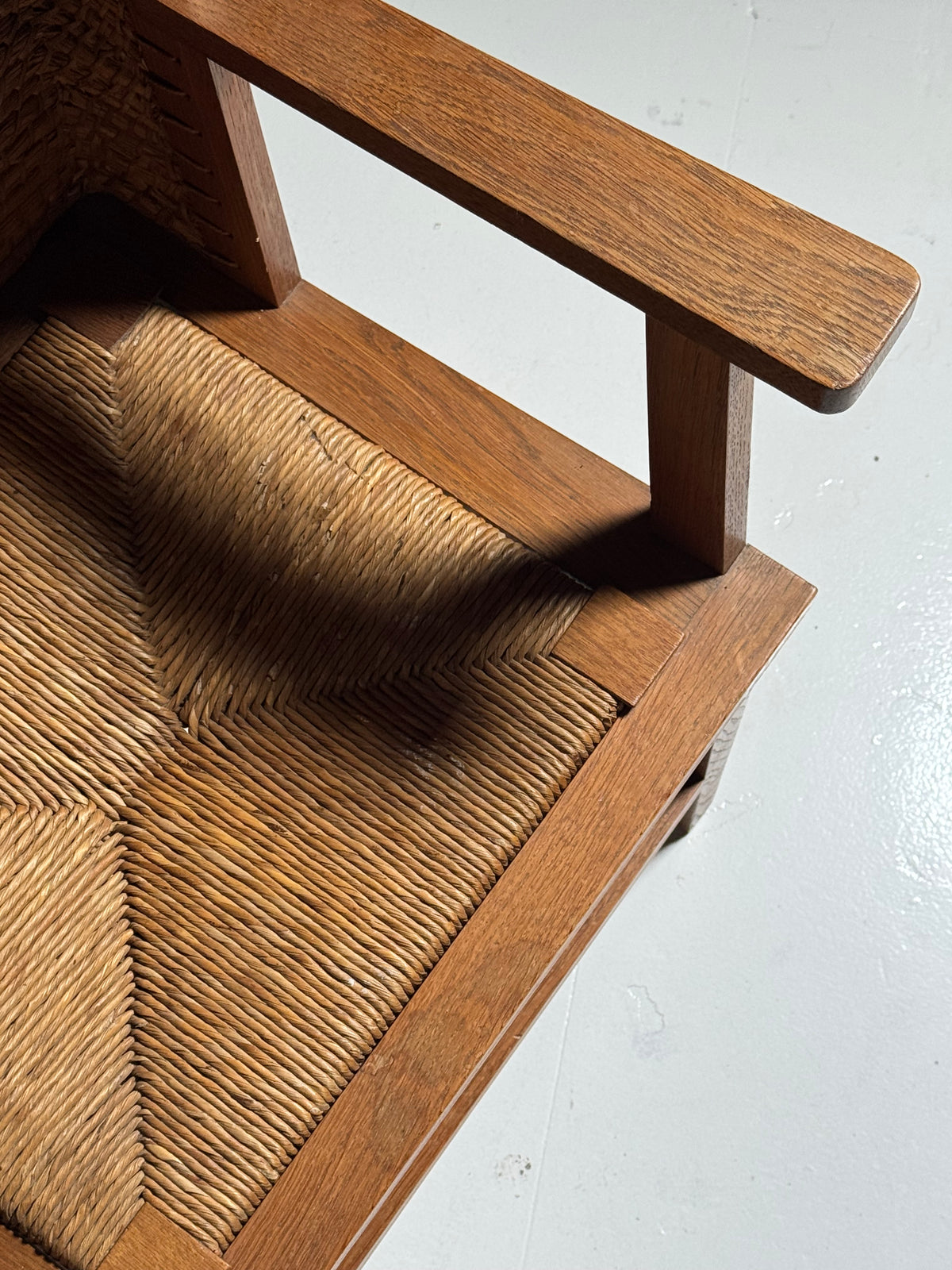 Armchair with a woven backrest