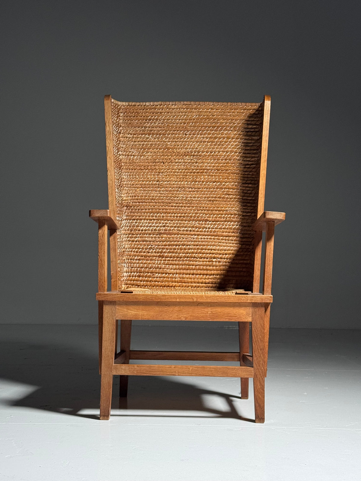 Armchair with a woven backrest