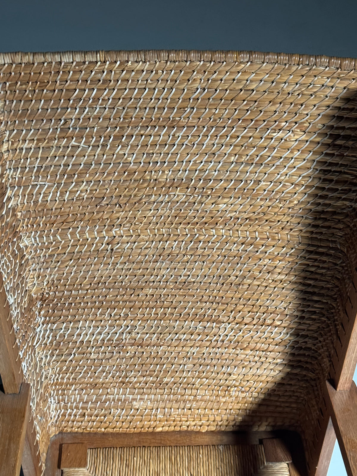 Armchair with a woven backrest